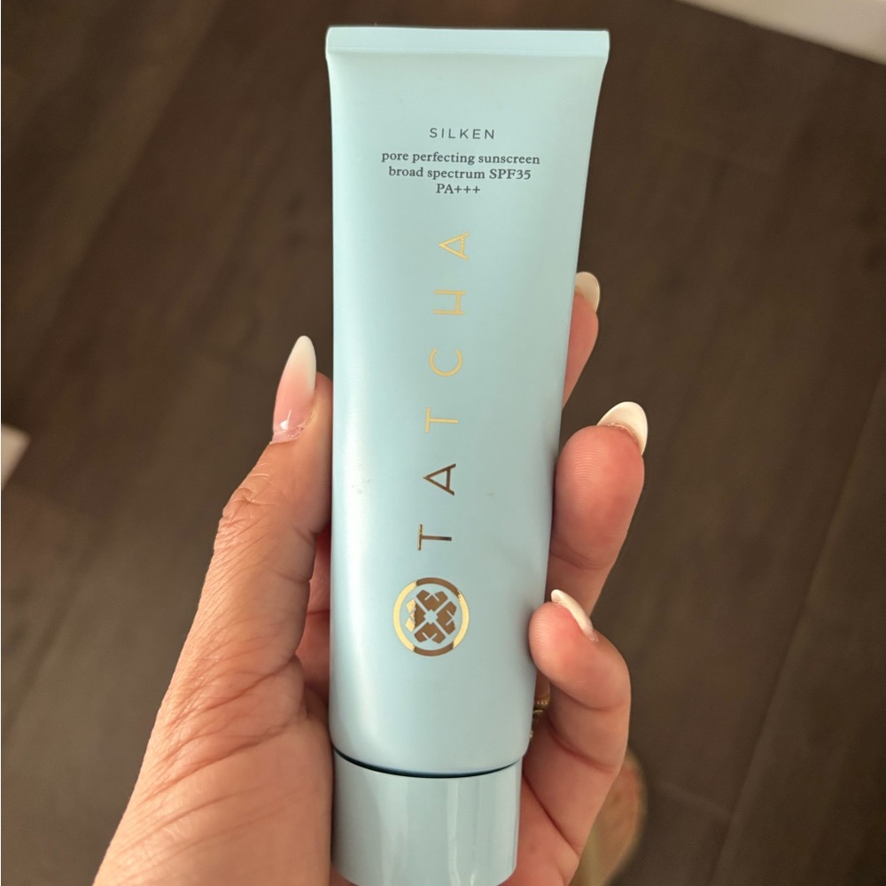 Tatcha Silken Sunscreen in Light Blue with Gold Text
